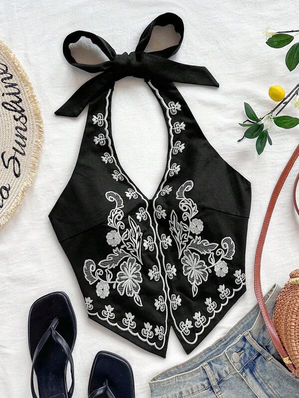 Soleia Top corto con cuello halter, espalda descubierta y lazo, con bordado floral sobre base color albaricoque, adecuado para festivales de música