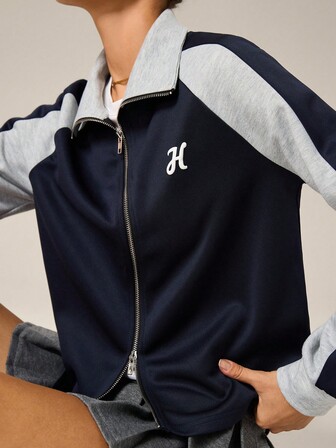 Hanevo Chaqueta corta holgada con cremallera delantera, mangas raglán y estampado de letras en bloques de color para mujer