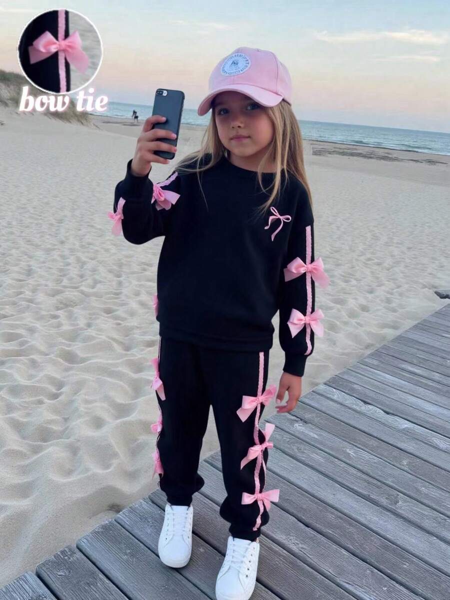 Elladie kids 年轻女孩 2 件套休闲时尚运动衫和裤子套装，粉色丝带和蝴蝶结装饰，长袖圆领套头衫搭配松紧腰慢跑裤，适合上学，秋冬 - 黑色 - 查看 1