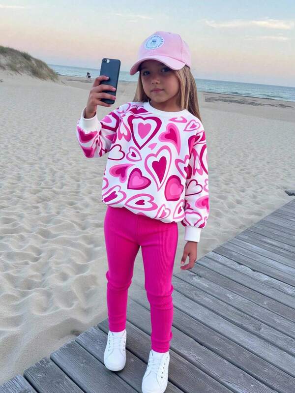 Set de 2 piezas con blusa de manga larga con estampado de corazón y pantalones rosas de estilo casual para niñas