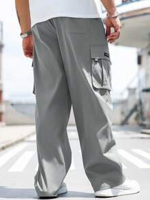 Manfinity Homme Pantalones casuales sueltos con bolsillo de unicolor para hombres talla grande, otoño - Gris Oscuro - Ver 2