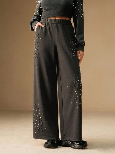 Pantalones deportivos anchos de mujer con cintura elástica, bolsillos en diagonal y decoración de rhinestones, estilo casual y urbano