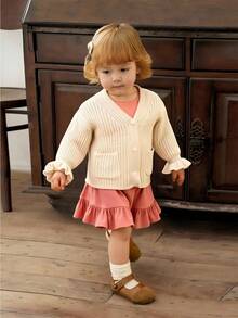 SHEIN Vintaside Kids 1 قطعة كارديجان للبنات، بأسلوب بسيط، لون موحد، ياقة على شكل حرف V، صدر واحد، جيوب مزدوجة متماثلة، أكمام مكشكشة فريدة، كارديجان محبوك أبيض مجوف، ملابس علوية متعددة الاستخدامات، مناسبة للخروجات، الربيع والخريف - لون مشمشي - مشاهدة 8