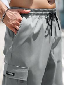 Manfinity Homme Pantalones casuales sueltos con bolsillo de unicolor para hombres talla grande, otoño - Gris Oscuro - Ver 3