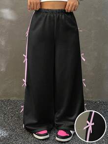 SHEIN Dziewczęce spodnie dresowe z kokardą i paskiem po bokach