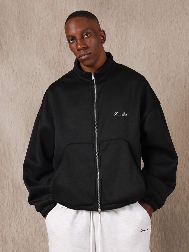 Giacca sportiva squadrata con tasche curve e colletto a coste