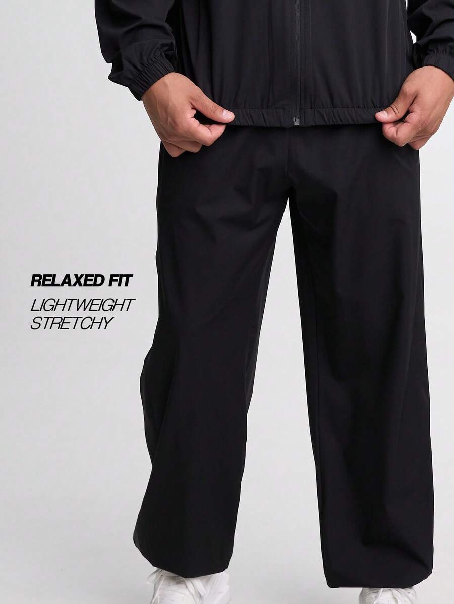 Pantalones jogger de ajuste holgado con cordón en la cintura para hombres, color negro - Negro - Ver 1