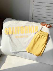 SHEIN 2 件套男婴和女婴休闲运动街头风格字母印花宽松圆领针织上衣 T 恤和松紧腰短裤套装，适合春夏季居家和户外穿着 - 黃色 - 查看 6