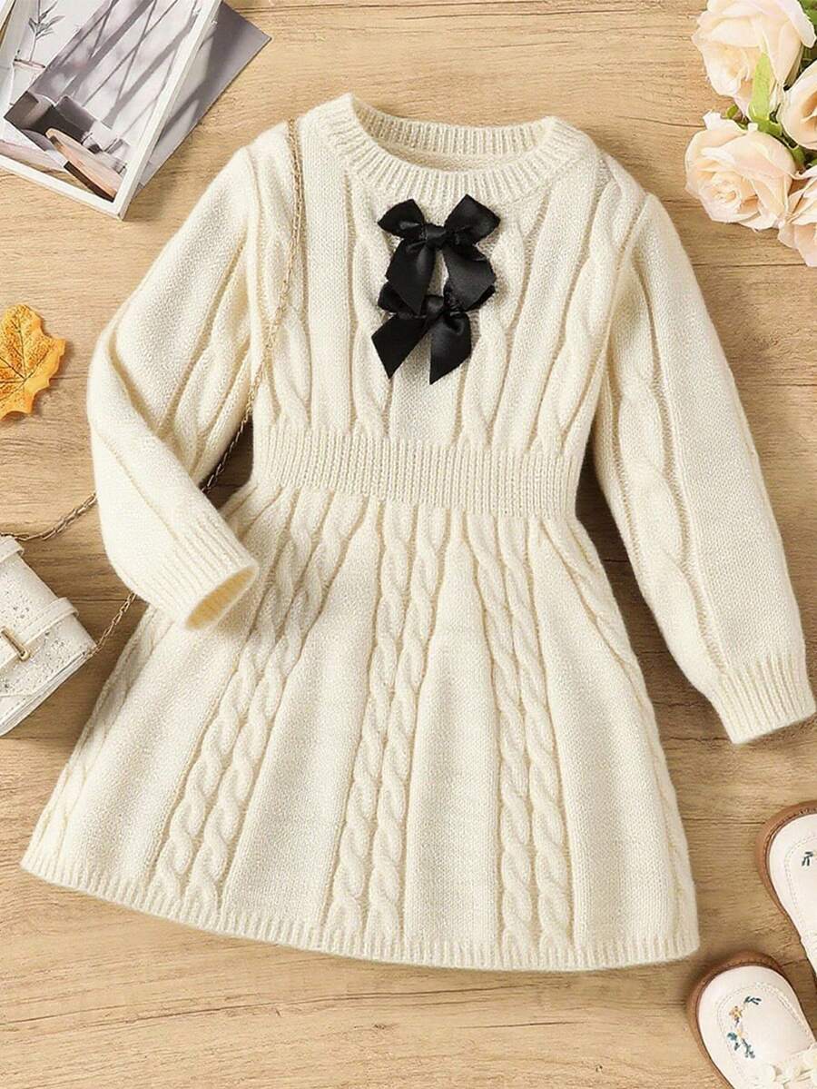 SHEIN Elladie kids 秋冬女童复古粗针织圆领腰部 A 字蝴蝶装饰长袖毛衣裙,适合户外休闲穿着 - 杏色 - 查看 1