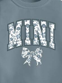 SHEIN Playful Pals Sweatshirt für Kleinkind Mädchen, lässige Mode mit kreativer Schleife, Blumen-Grafik, Slogan-Aufdruck, Rundhalsausschnitt, Herbstoutfit