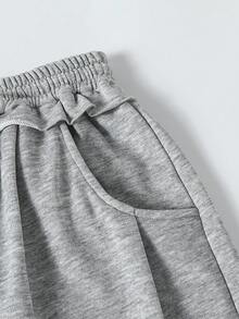 Sparklyn 一套青少年女孩时尚宽松舒适灰色卫衣裤套装，毛边下摆设计，喇叭裤腿，适合休闲、旅行、聚会、运动、上学、通勤等多种场合，适合春、秋、冬三季穿着。