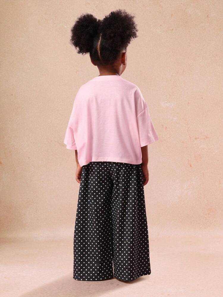 Top con stampa a pois e cuore e pantaloni a gamba larga