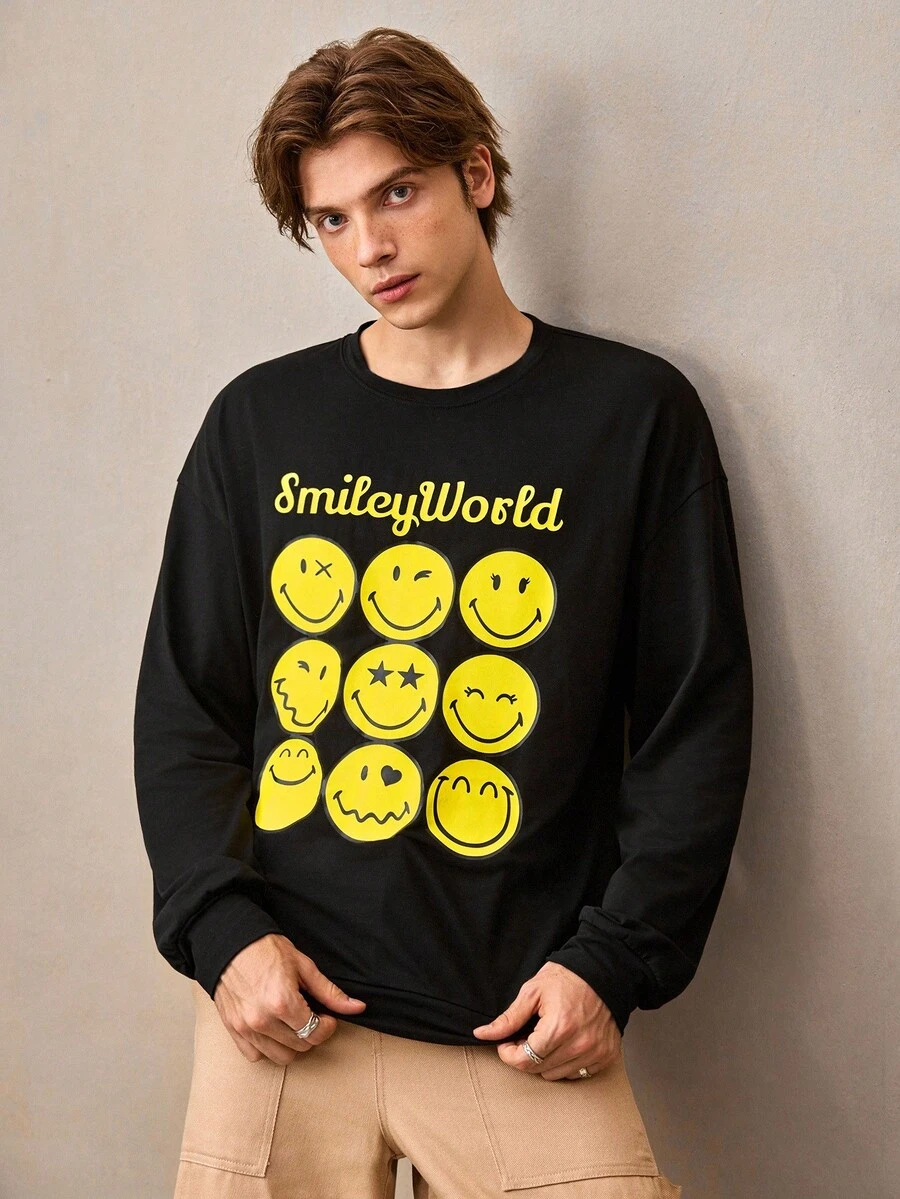 SmileyWorld® | SHEIN تي شيرت كاجوال للرجال بأكمام طويلة فضفاضة وطبعات كرتونية وحروف، مناسب للارتداء اليومي والتنقل، موسم الربيع/الخريف - الأسود - مشاهدة 1