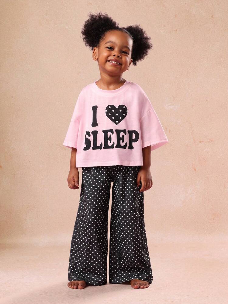 Top con stampa a pois e cuore e pantaloni a gamba larga