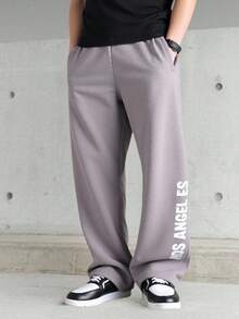 SHEIN Lose geschnittene, gerade geschnittene graue Hosen mit Blume Muster für Teenager-Jungen, lässiger Schul- und College-Stil, bequeme Mode, vielseitiger, weicher Stoff, geeignet für den täglichen Gebrauch, Schule, Reisen, Outdoor-Sport, Frühling/Sommer - Grau - Übersicht 2