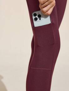 Easithlete Quần legging nữ trơn màu có túi khóa kéo ngoài trời, thường ngày và thể thao - Màu tím - Xem 3