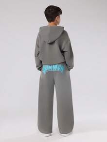 SUMWON Conjunto de chándal de estilo urbano de dos piezas con sudadera con capucha y pantalones anchos a juego para usar en invierno y otoño de manera casual - Gris - Ver 2