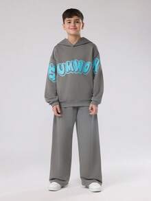 SUMWON Conjunto de chándal de estilo urbano de dos piezas con sudadera con capucha y pantalones anchos a juego para usar en invierno y otoño de manera casual - Gris - Ver 1