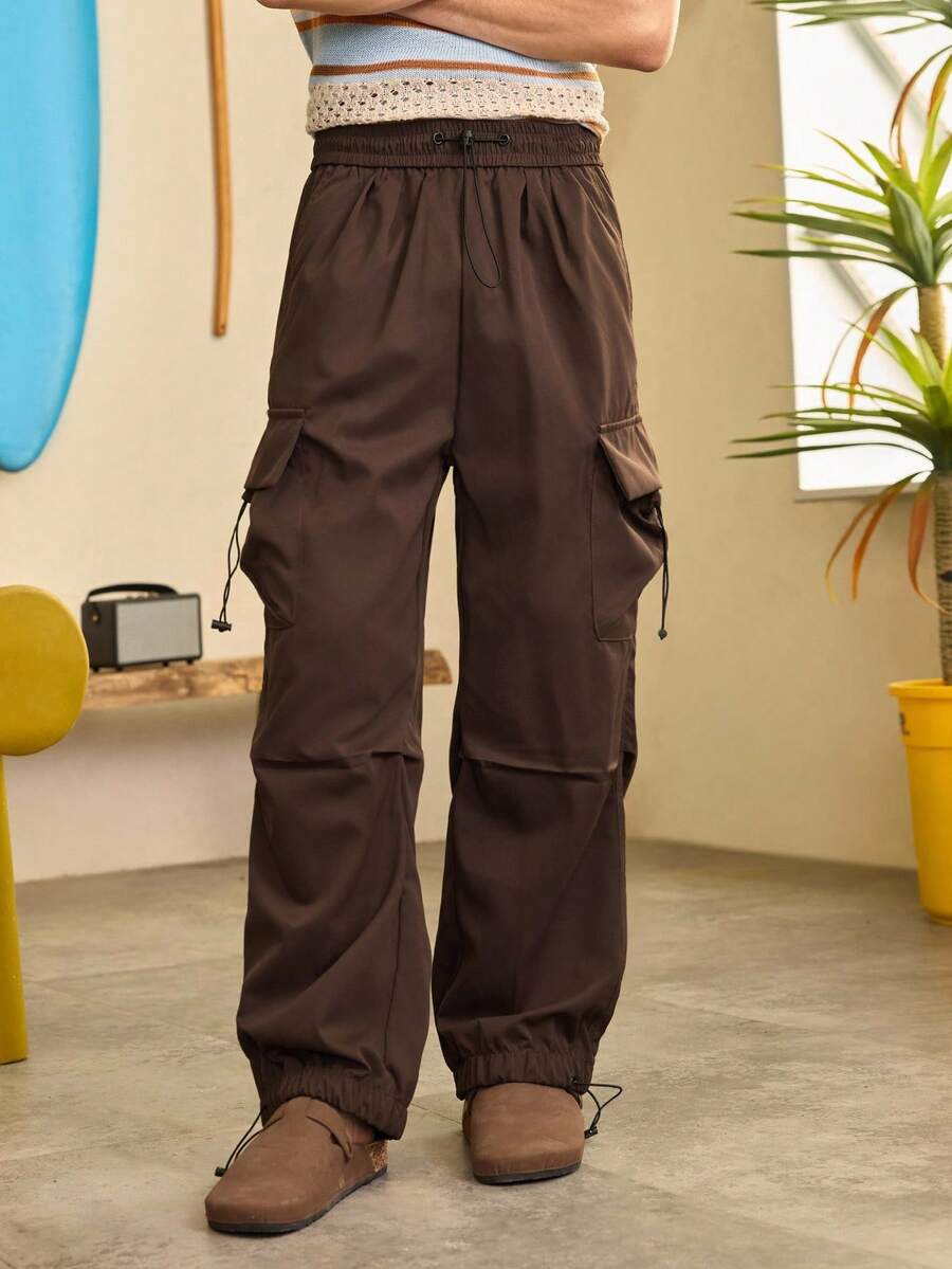 Open Phase Pantalones cargo funcionales de paracaidista STONE DISTRICT, pantalones casuales rectos de pierna ancha de estilo holgado y de moda de marca para hombres, ropa de calle exterior para hombres de primavera a verano, estilo retro americano, unisex, ajuste relajado, adecuado para uso diario y atuendos de vacaciones de verano. - Café integral - Ver 1