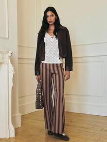 Nöista Muted Tones And Soft Vertical Lines Offer A Refined Silhouette With A Flared Leg. Styled With A Brown Sweater Or Going Out Tops For Women, It Pairs Well With Elegant Blouses For Women During Fall And Autumn.