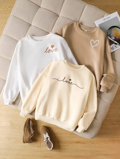 SHEIN 3 piezas Sudaderas holgadas de cuello redondo informales para niñas preadolescentes, con estampado de corazón y eslogan, en color caqui, blanco y marrón, ropa de otoño e invierno para niñas