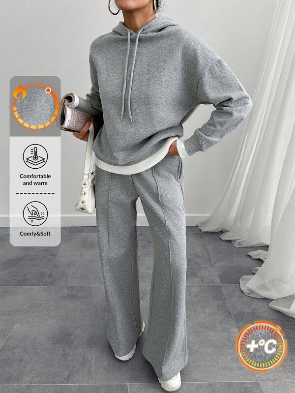 Completo da donna in due pezzi, composto da maglione oversize e pantaloni in felpa grigio melange