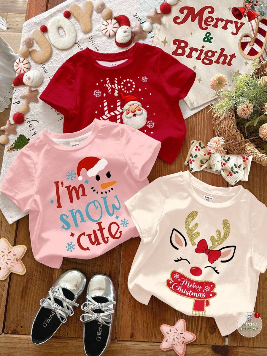 SHEIN 3 pièces T-shirts à col ras du cou manches courtes décontractés pour bébés filles avec des motifs de Noël mignons comme amande crème, rose crème, rouge de Noël, célébration de dessin animé, bonhomme de neige amusant, flocon de neige, Père Noël, convenant pour toutes les saisons - Multicolore - Voir 1