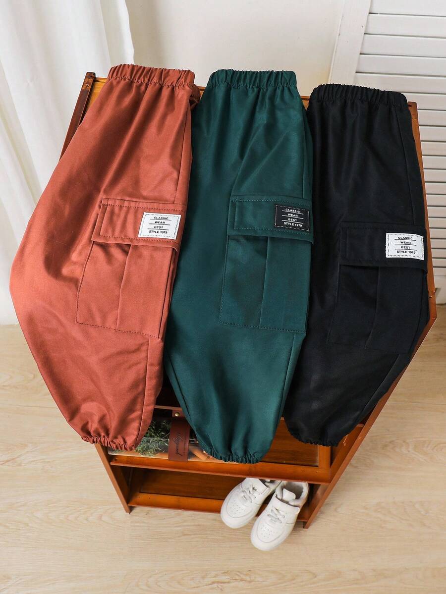 SHEIN 3pcs Young Boys Casual Sports Streetwear Cute Vacation Black Decorative Stripe Loose Fit Green/Black/Khaki Jogger Pants, Suitable For Daily Wear, School, Travel, Sports, Spring/Summer/Autumn/Winter Parachute Pants Windbreaker Pants Pants Pack Cargos Baggy Cargo Pants