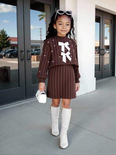 Young Girl' Brown Fuzzy Turtleneck Long Sleeve Top With Pearl Embellishments On Cuffs, Front Panel And Sleeves, Paired With A Pinafore Dress With White Bow Accents, Playful, Cute And Elegant For Everyday Or Occasion Wear Fall Winter