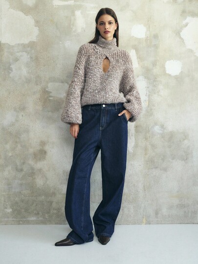 Nöista Calça jeans azul-escuro atemporal, com corte reto, ideal para looks de outono e inverno femininos. Confeccionada em jeans estruturado com um corte de cintura média elegante, ela é uma peça essencial no guarda-roupa, combinando facilmente com suéteres, blusas ou casacos para qualquer look de outono.