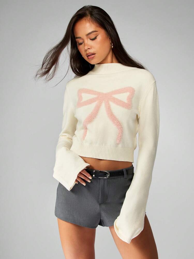 MISSGUIDED Pull court élégant à manches cloche avec motif nœud rose moelleux. Pull tricoté col montant pour l'hiver et les fêtes