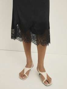 Nöista Chân váy thanh lịch dành cho nữ với viền ren tinh tế, hoàn hảo cho những dịp trang trọng, trang phục dự tiệc và vẻ ngoài tinh tế của mùa đông; Một món đồ đa năng dễ dàng kết hợp với áo cánh hoặc đồ dệt kim, mang đến vẻ tinh tế vượt thời gian cho tủ đồ mùa đông của phụ nữ để tạo phong cách thường ngày, trang phục thanh lịch, trang phục Giáng sinh và lễ kỷ niệm năm mới sang trọng. - màu đen - Xem 4