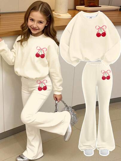 SHEIN Conjunto informal de 2 piezas de sudadera holgada con cuello redondo y estampado gráfico de lazo rosa vintage y cereza, y pantalones acampanados para niñas preadolescentes