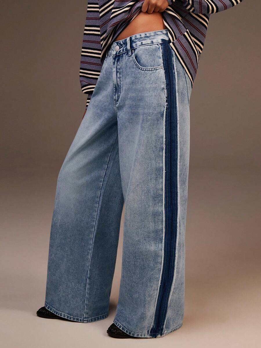 Athîral 这款女士高腰阔腿宽松牛仔裤休闲百搭，并带有口袋。这款蓝色水洗做旧阔腿牛仔裤非常适合秋冬季节，是日常穿着的理想之选。时尚的设计以及与复古长裤的完美搭配，使其成为秋季穿搭的绝佳选择。 - 藍色 - 查看 1