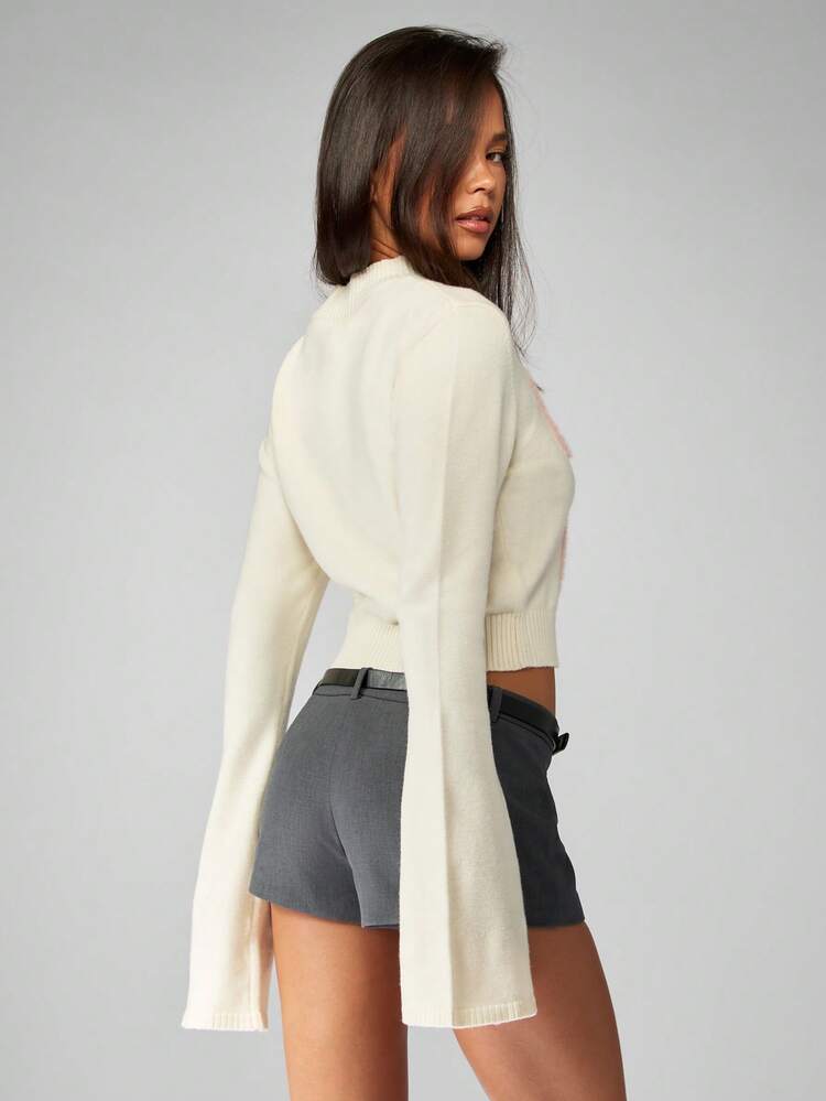 MISSGUIDED Pull court élégant à manches cloche avec motif nœud rose moelleux. Pull tricoté col montant pour l'hiver et les fêtes