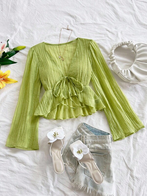 Soleia Blusa con mangas de campana, volantes en el bajo y lazo delantero