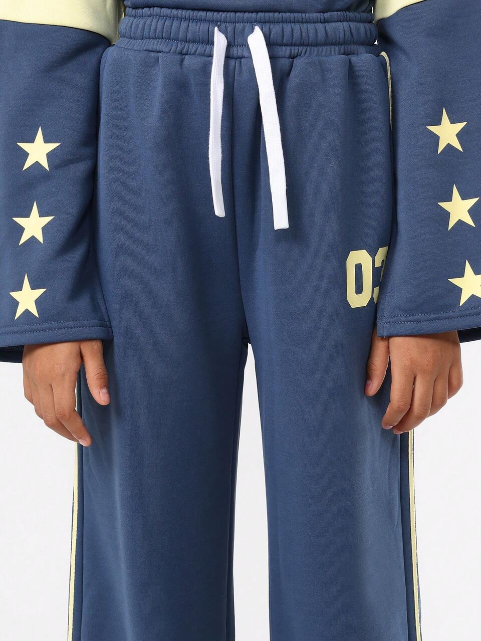 Blusa de moletom com manga sino e calça de moletom larga e estrelas