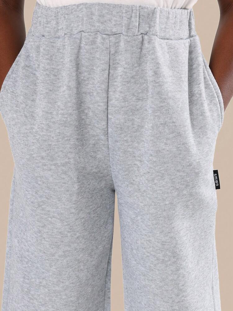 Heathered Loose Fit Pants With Side Pockets And Elastic Ankles