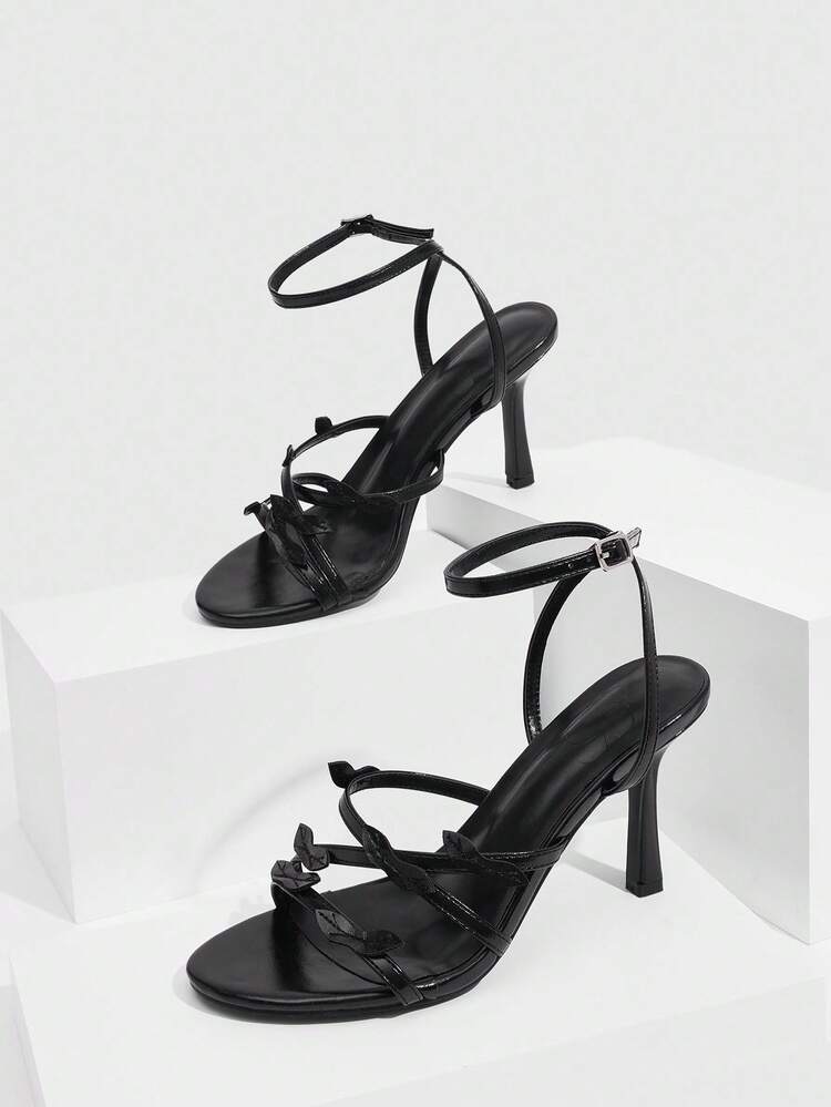 CUCCOO SZL Black PU Strap Asymmetrical Leaf Decor Fashionable Sexy Glamorous Metallic Nightclub Style Round Toe High Heel Sandals