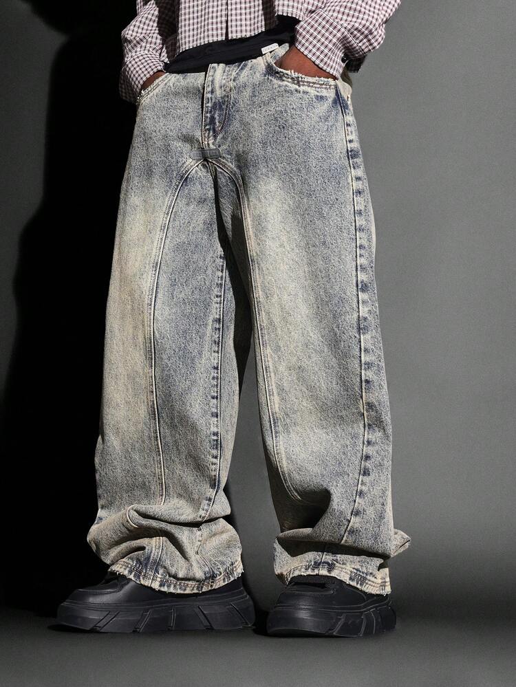 Jeans a gamba larga con pannelli e orlo rovinato