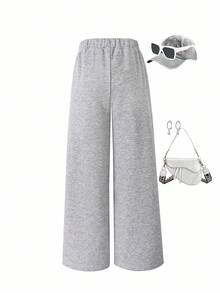 Sparklyn Niezbędnik na jesień/zimę! Dziewczęce spodnie z prostymi nogawkami, wykonane z wysokiej jakości dzianiny dresowej, miękkie i wygodne. Prosty krój nogawek podkreśla kształt nóg, modne i uniwersalne, ciepłe przez całą zimę, idealny wybór do jesienno-zimowych stylizacji dla dziewcząt.