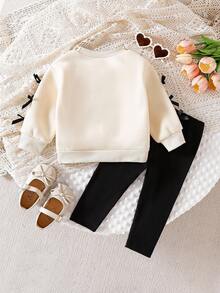 SHEIN 2 件套婴幼儿女童白色运动衫，带有可爱卡通印花和蝴蝶结装饰，长袖圆领运动衫和黑色松紧腰紧身裤，适合休闲、运动、日常穿着、外出、旅行，6 个月至 2-3 岁 - 彩色 - 查看 2