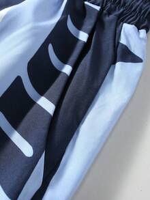 ROMWE MEN Street Life Men Contrast Color Patchwork Cross & Letter Graphic Loose Fit Sweatpants, Fall