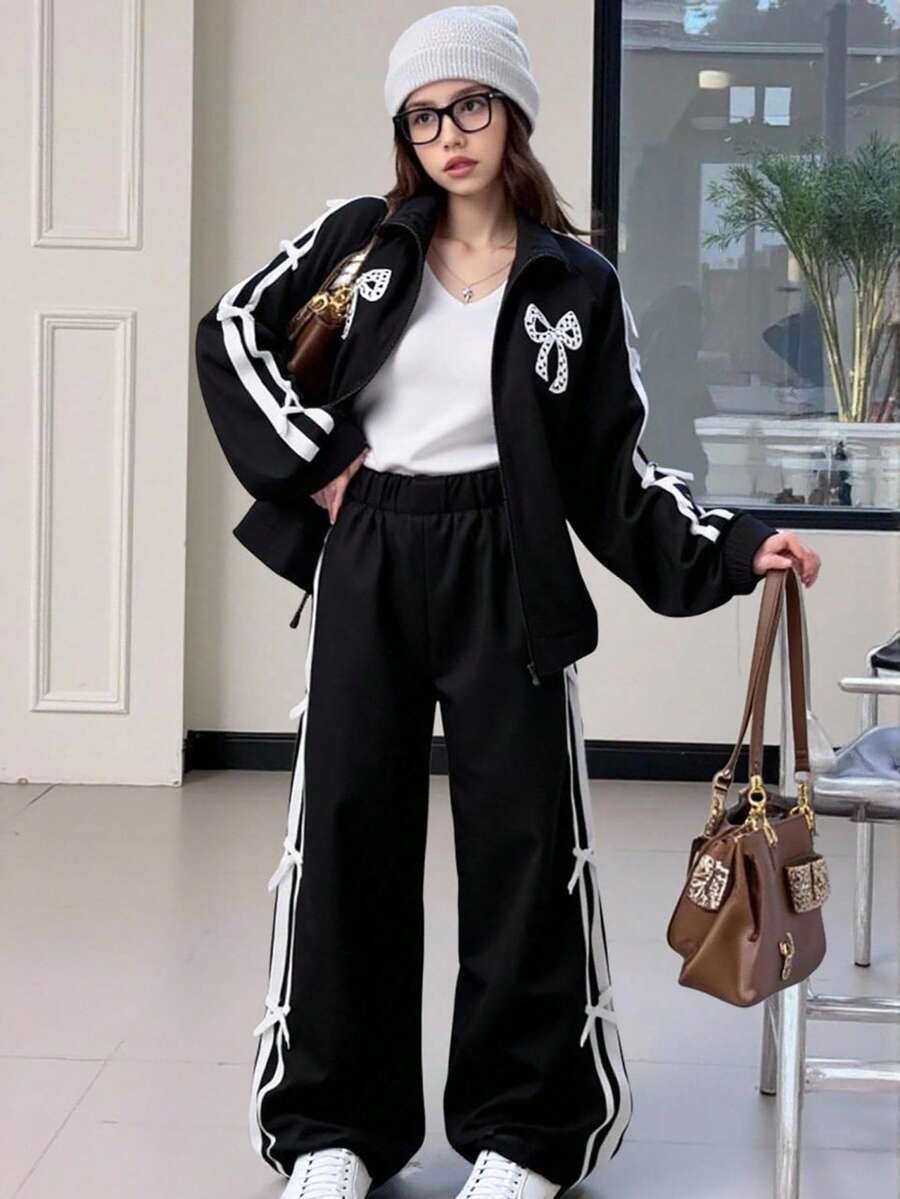 2pcs/Set Fashionable Casual Girls' Black Patchwork White Ribbon Sports Jacket With Zipper Stand Collar And Loose Fit Pants, Bowknot Print On Front, White Ribbon Patchwork On Sleeve And Pant Side, Suitable For Autumn/Winter, Warm, Outdoor, Street, Daily Casual, Home, Travel, School Season Fall
