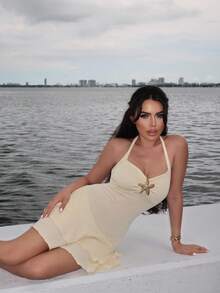 Durrani Popal Women's New Spring Summer Suitable For Beach Vacation Elegant Textured Fabric Halter Tie Front Ruched Bust Metal Decor Layered Ruffle Hem Playful Mini Dress - Yellow - View 1