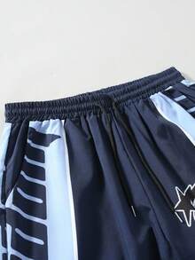 ROMWE MEN Street Life Men Contrast Color Patchwork Cross & Letter Graphic Loose Fit Sweatpants, Fall