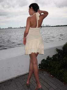 Durrani Popal Women's New Spring Summer Suitable For Beach Vacation Elegant Textured Fabric Halter Tie Front Ruched Bust Metal Decor Layered Ruffle Hem Playful Mini Dress - Yellow - View 2