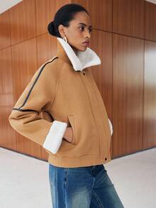 Lumivelle Abrigo de mujer con cuello de piel sintética y dobladillo de color contrastante