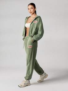 Missguided x Playboy Cotton Relaxed Fit Casual French Terry Jogger Pants With Elastic Waistband Cuffed Ankle Streetwear Loungewear Washed Vintage Look Retro Script - Olive Green - View 4