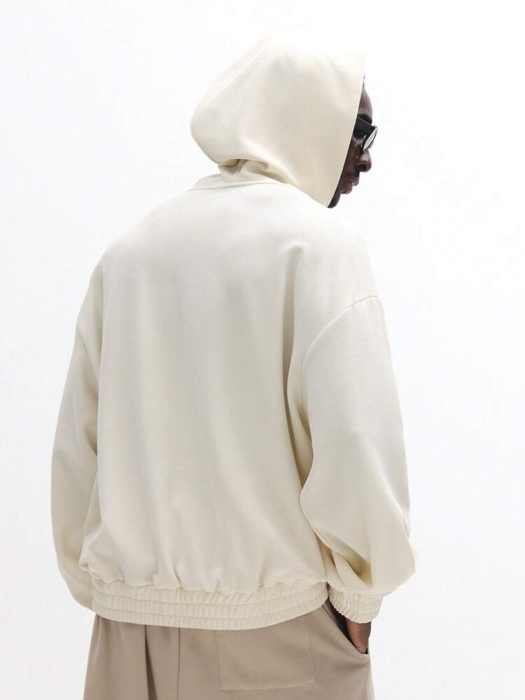 Felpa con cappuccio testurizzata con zip intera, tasche laterali e profili